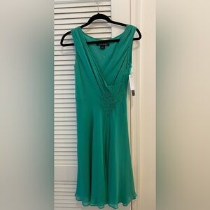 Anne Klein sleeveless dress, 100% silk. Size 4. Light green. Fully lined. W tag